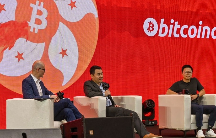 Harvest CEO Han Tongli (center) speaks at Bitcoin Asia on May 9, 2024. Source: SCMP
